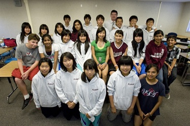 Student delegate visitors wearing Lawson sweatshirts, along with their Lawson student tour guides and Assistant Principal, Jeff Bowman.